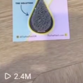 Product packaging for 'The Pee Patch' on a wooden surface with a icon that reads 2.4Million views